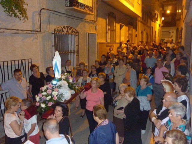 La delegación de Lourdes de Totana celebra el Santo Rosario por las calles de Totana